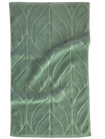 Green textured towel with leaf pattern on a white background